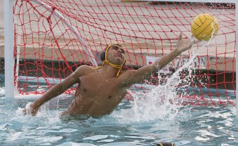 Tiger boys' water polo beat Redwood in WYL play, ladies lose 9-3 Lemoore junior varsity player Matt Martin defends his goal in loss to Rangers Thursday night.